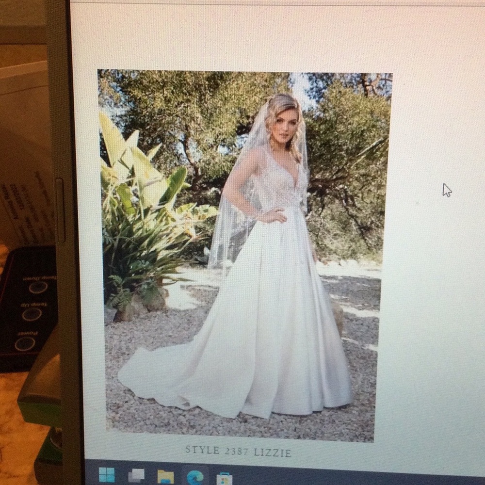 Casablanca Bridal Gown. A line gown that is both simple and stunning!